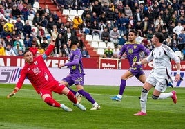 Albacete's Morcillo, right, dinks the ball over keeper Herrero to make it 2-0.