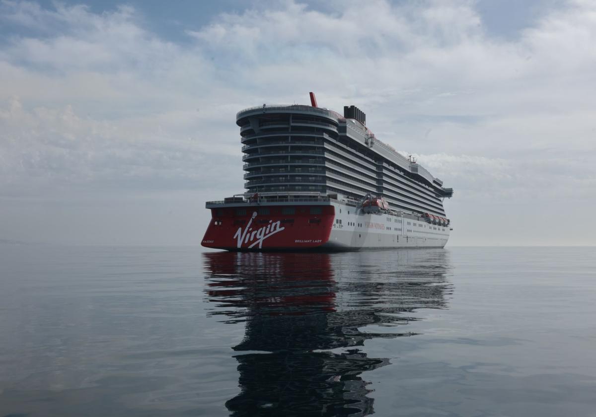 Why is there a Virgin cruise ship anchored in a bay off the Costa del Sol?
