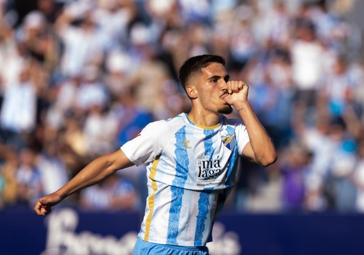 Malaga forward Chupete celebrates giving his side a first-half lead.