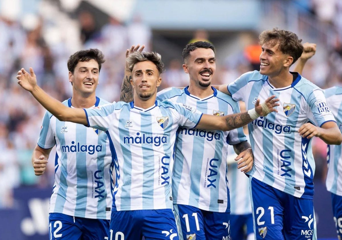 Larrubia celebrates making it 1-0 with his teammates.
